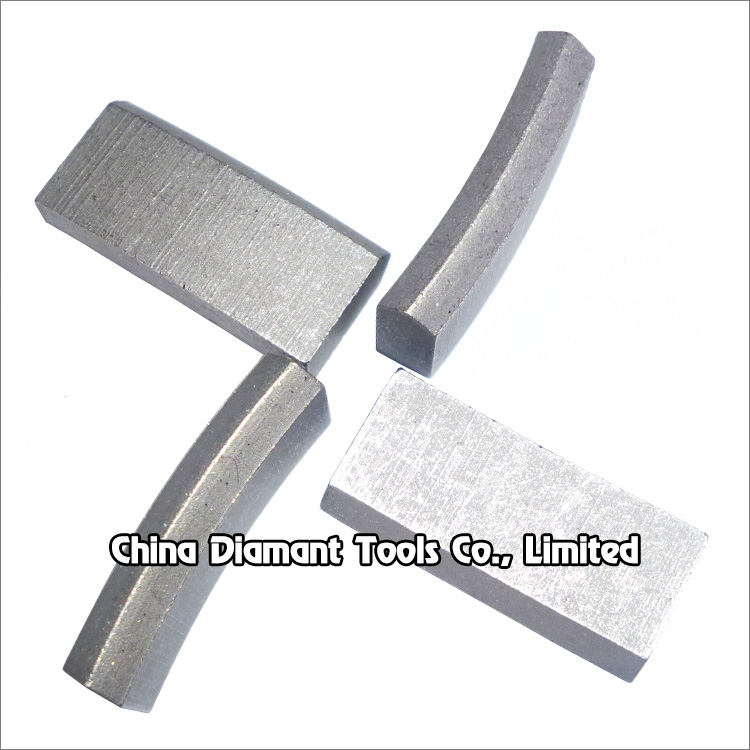Diamond segments of drill bits - cuspate top (roof) shape